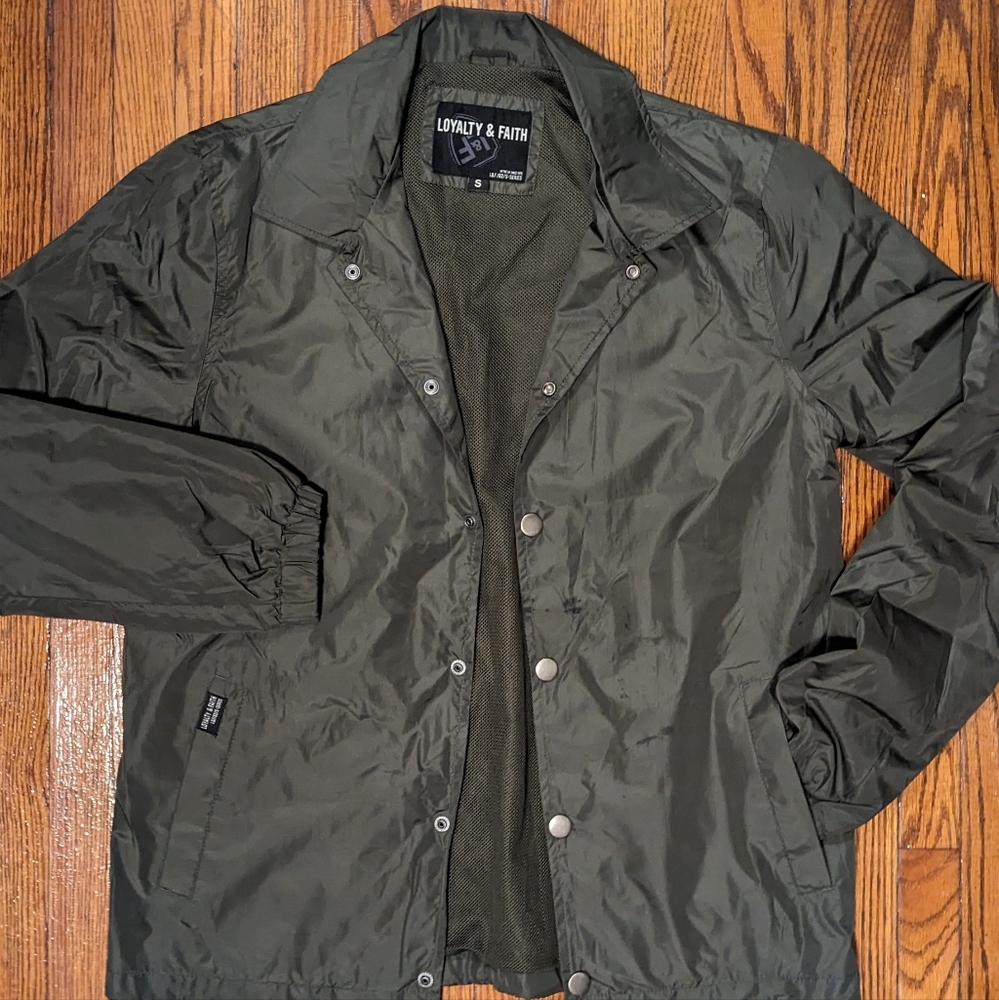 Loyalty and faith green windbreaker small